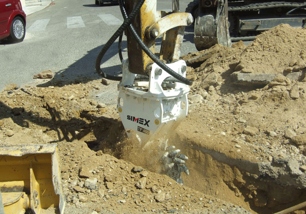 Simex twin header rock grinder in road works and utilities